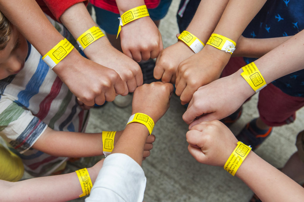 Children wearing lost child wristbands